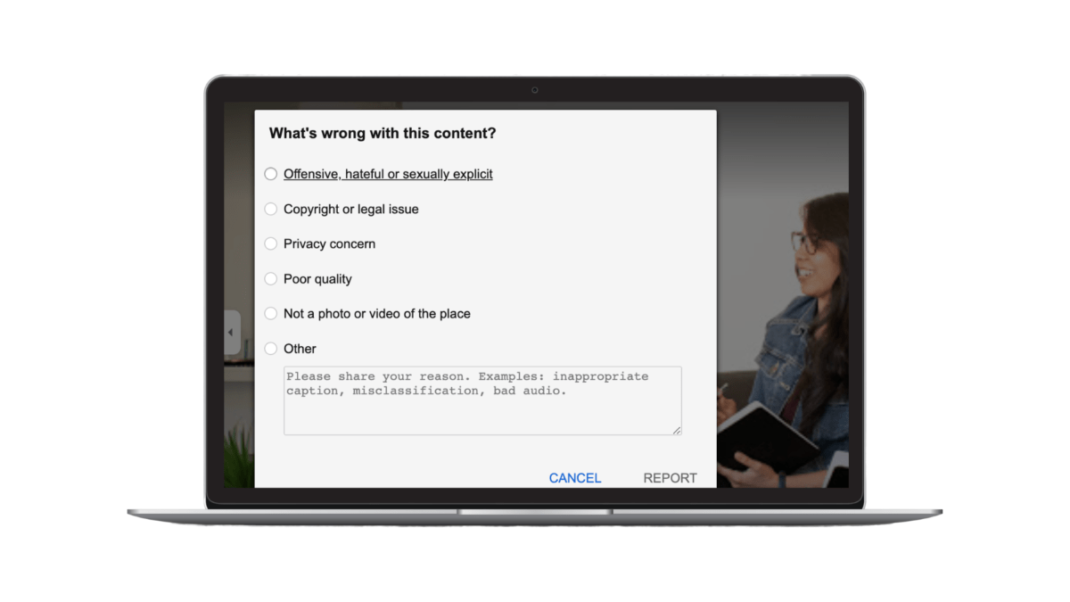 Example of how to flag a photo or video on a Google Business Profile. There’s a light gray square with a list you can select from in the background is a woman sitting and taking notes on a couch.