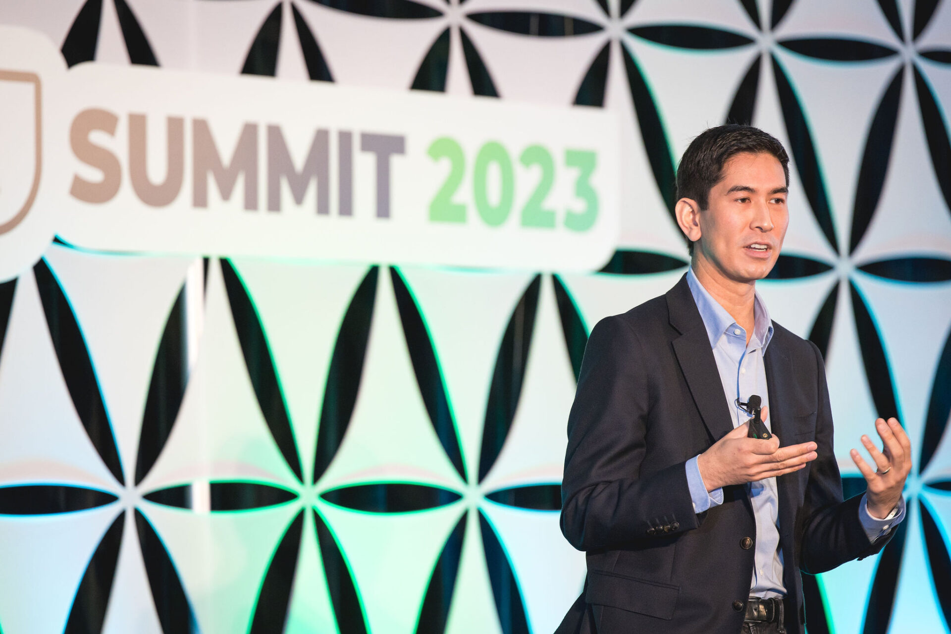 An image of our keynote speaker, Dex Hunter-Torricke, speaking at SOCi Summit