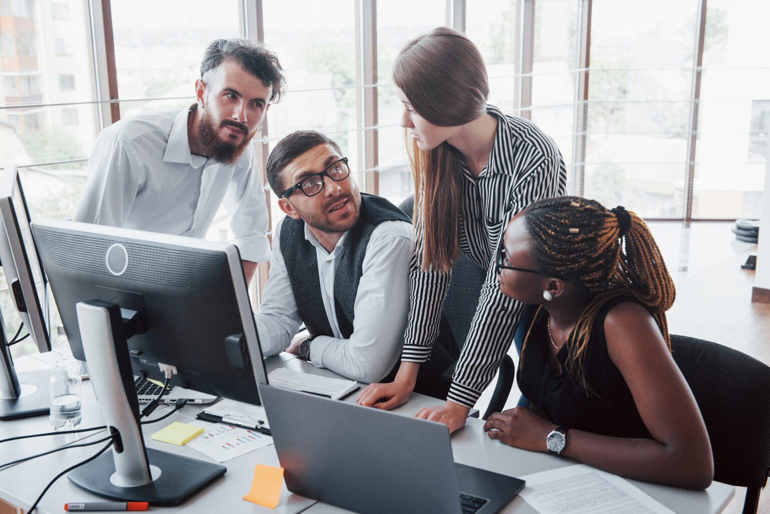 group of young employees working together